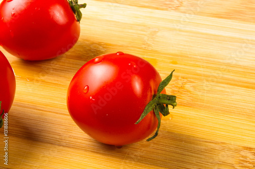 tomatoes on wooden background