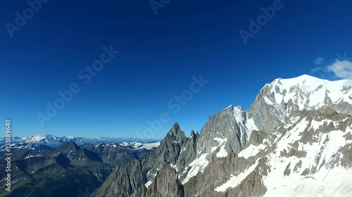 Panoramic view of Western alps whith Mount Blanc and Giant's Tooth (Dent du Geant) from Helbronner roof of europe in Aosta Valley region of Italy