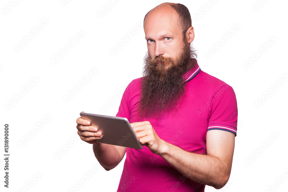 portrait of bald bearded man with tablet and pink t-shirt isolated on white background.
portrait of bald bearded man with tablet and pink t-shirt isolated on white background.
