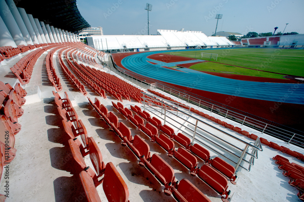 Fototapeta premium Colorful of stadium seats in background.