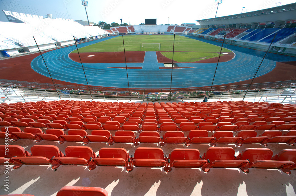 Obraz premium Colorful of stadium seats in background.