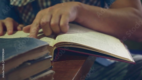 man reading an old book close-up education turns the page video