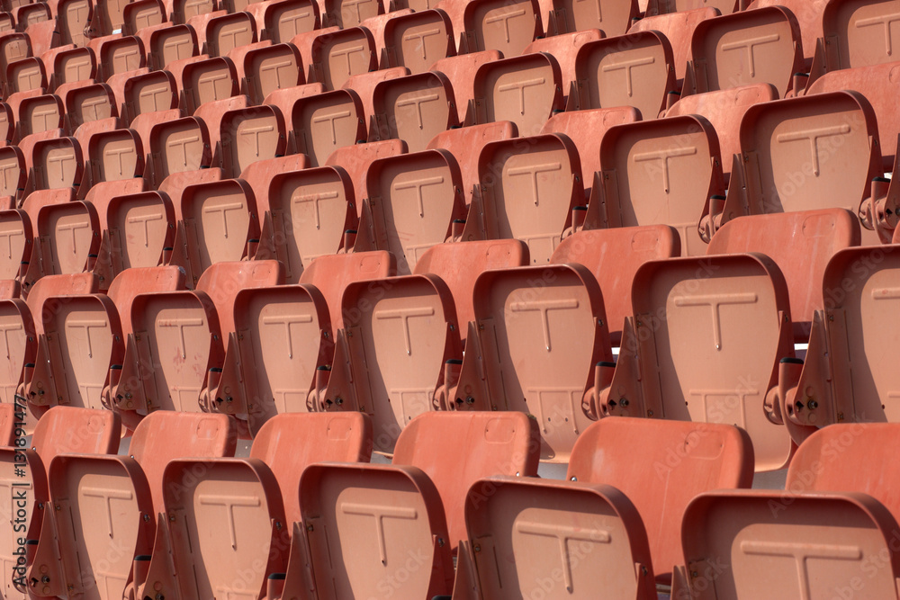 Fototapeta premium Colorful of stadium seats in background.
