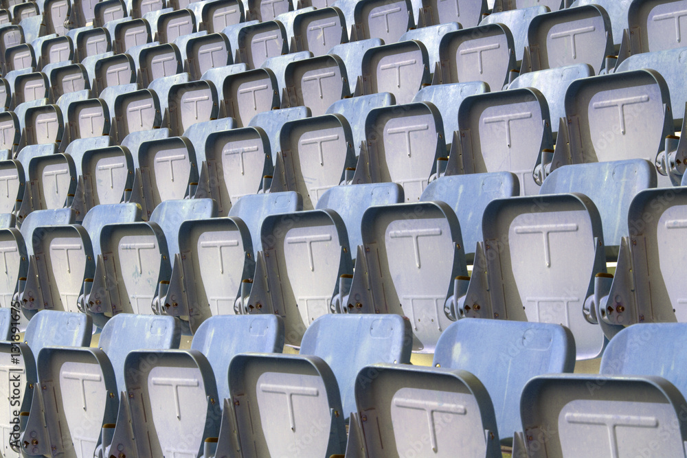 Fototapeta premium Colorful of stadium seats in background.