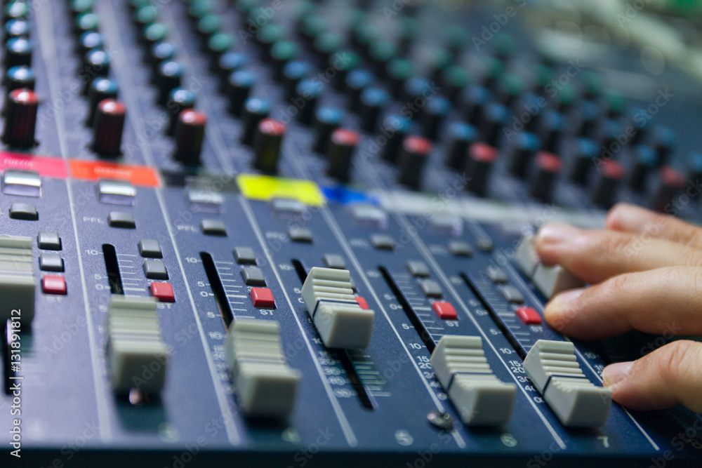 selective focus finger tuning of sound mixer close up selective focus finger tuning of sound mixer close up