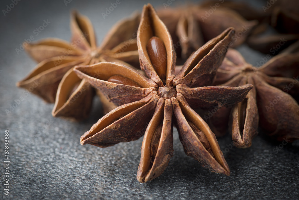 Star anise,cinnamon and licorice on grey background Star anise,cinnamon and licorice on grey background