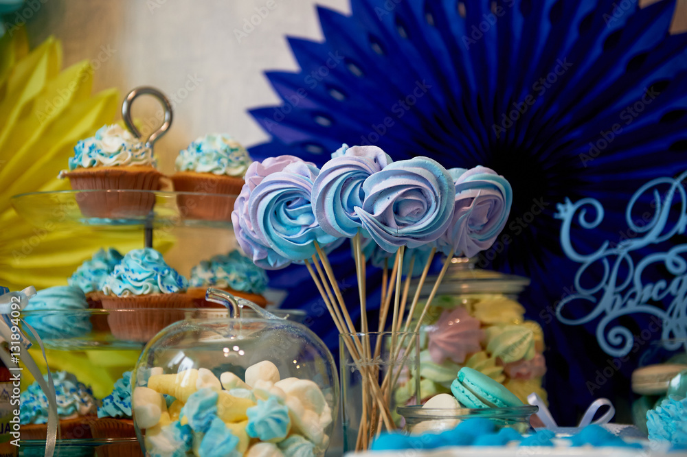 Sweet table for children's birthday party in turquoise and purple. A sense of celebration, of joy. Beautiful sweets