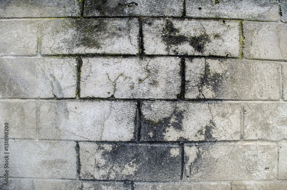 Obraz premium Fragment of old dirty brick wall with peeling plaster texture painted white may use to interior design or stone surface
