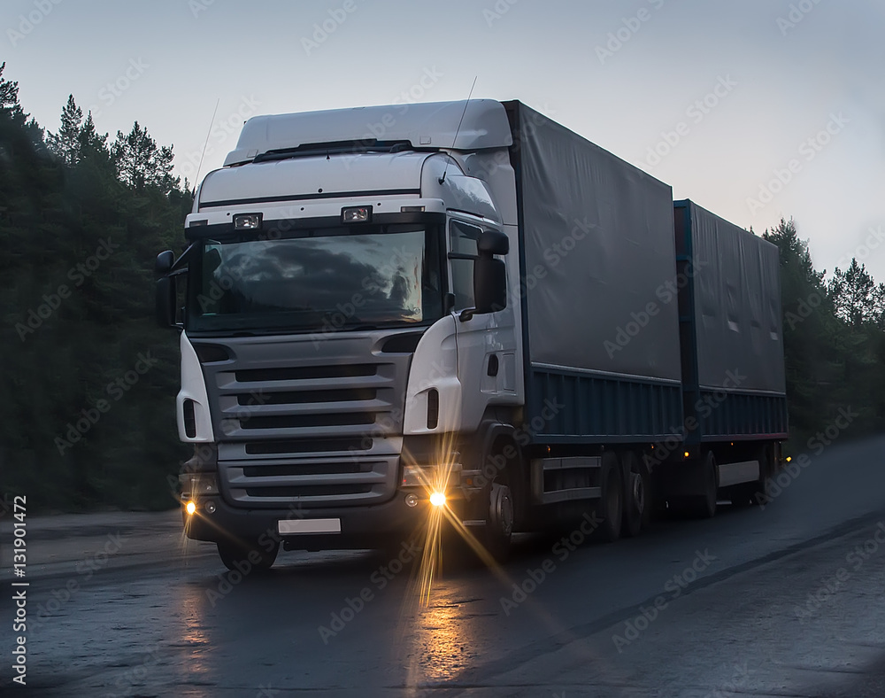 truck moves on highway at night