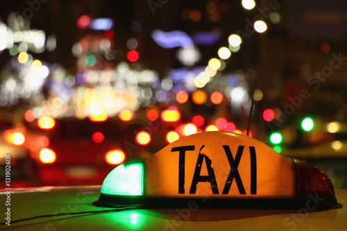 Taxi at night with lights signal system works.