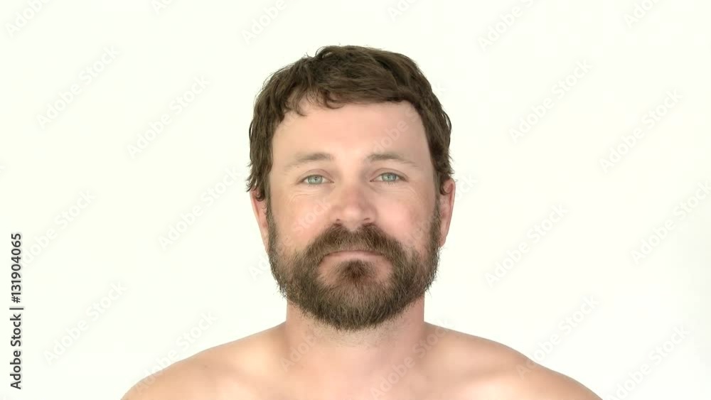 Model released man in studio with beard looking at camera smiling. Captured in 4K. Model released man in studio with beard looking at camera smiling. Captured in 4K.