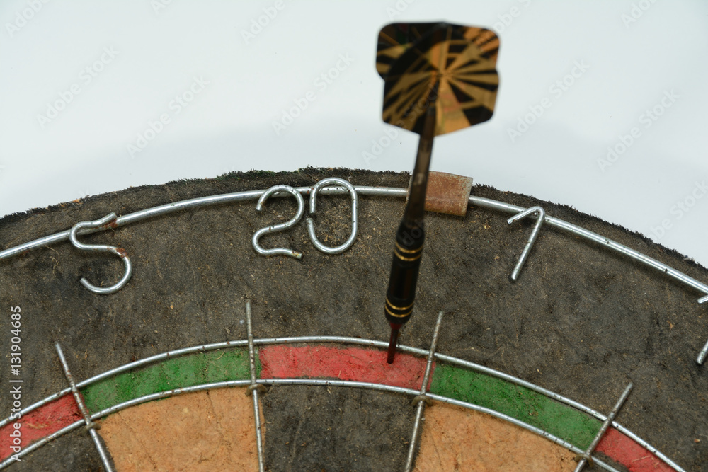 Foto Stock Dart hitting double 20 on dart board to start cricket game or 301  game | Adobe Stock