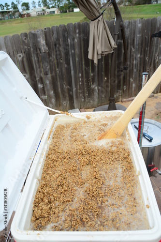 Bilde på lerret Home brew stirring mash tun with large wooden paddle