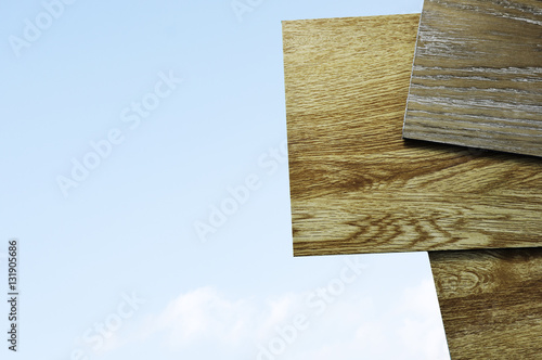 Laminate Wood Concept - A studio photo of laminate vinyl flooring on wooden background.