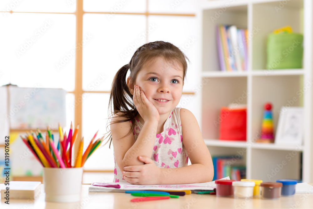dreamy child girl with pencils in nursery dreamy child girl with pencils in nursery