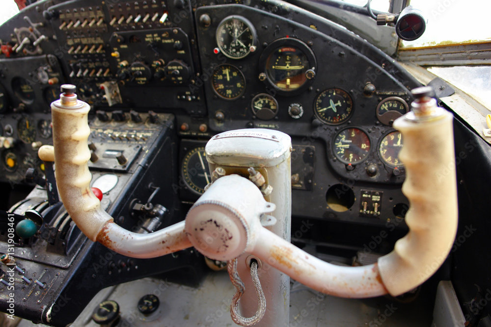Inside the cockpit of the old plane. The steering wheel of the plane