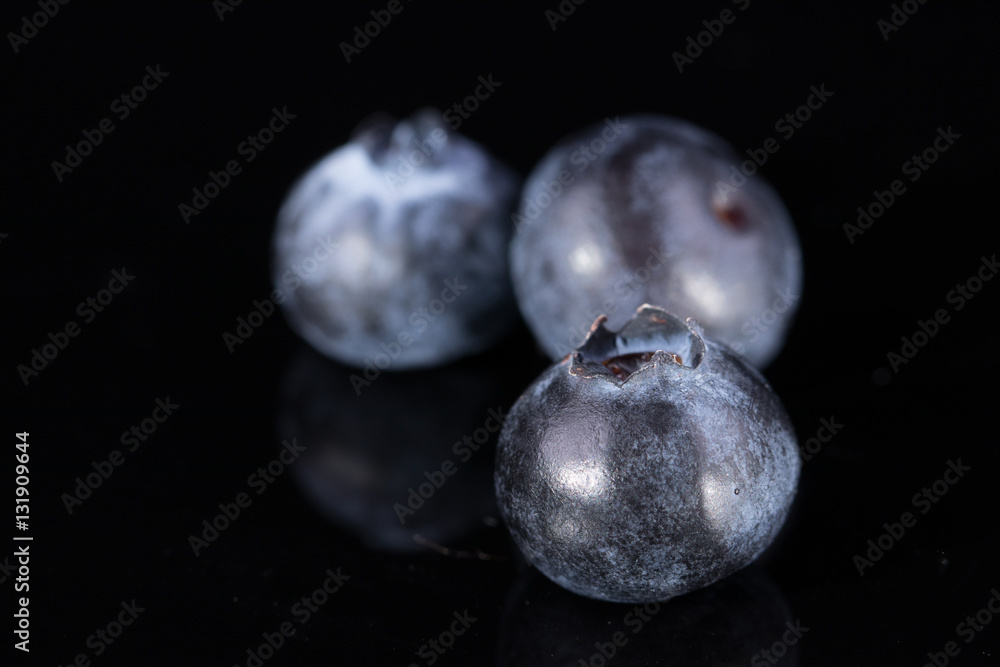 Three blueberries isolated on black Three blueberries isolated on black
