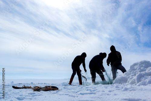  Winter fishing on frozen cildir lake in the province of Ardahan. photo