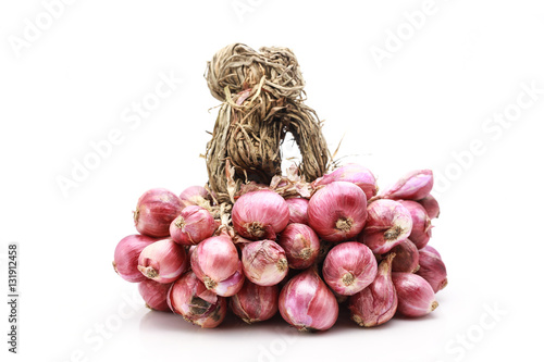 Shallot onions in a group on white