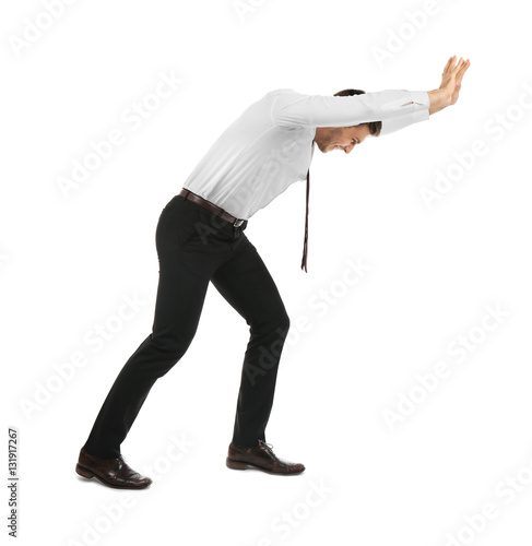 Photos Businessman pushing invisible wall isolated on white