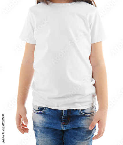 Little girl in blank t-shirt on white background, close up