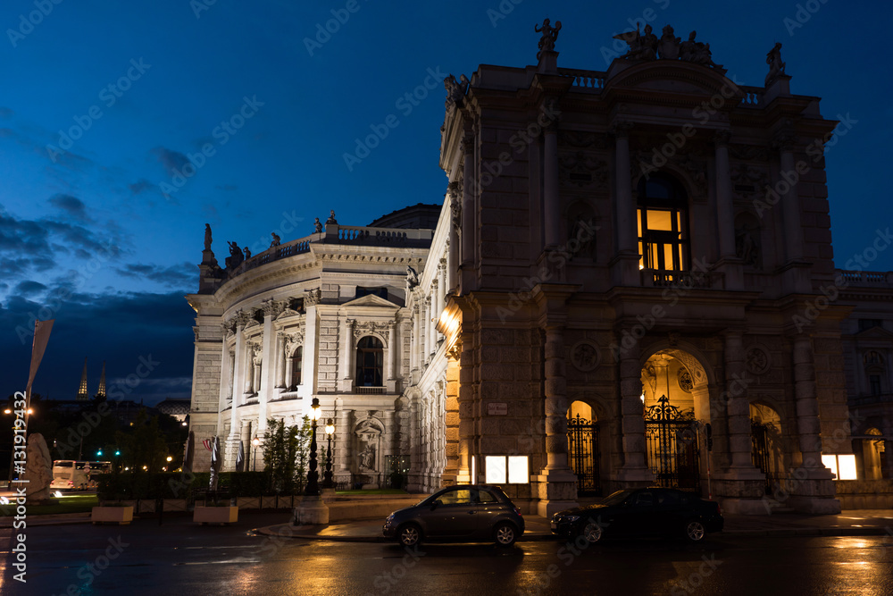 Beautiful view of historic burgtheater imperial court theatre in the evening and cars on street, vienna, austria