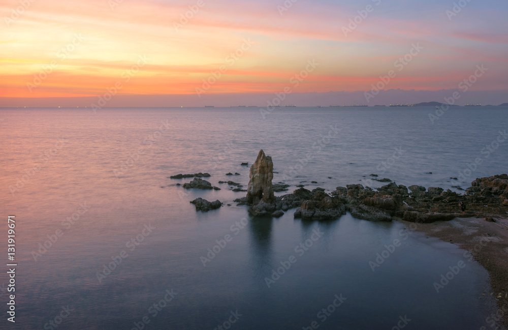 a pillar stay lonely in the sea shore of east part of Thailand in Sunset Scenery a pillar stay lonely in the sea shore of east part of Thailand in Sunset Scenery
