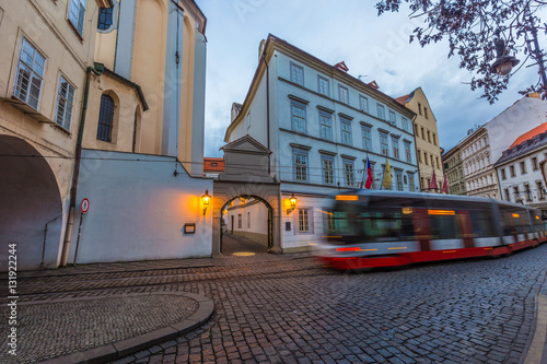 Wide-angle view of classic tram at old street in Prague, Czech Republic