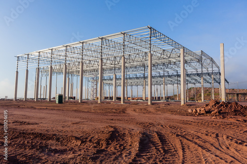 Construction Building Structure frame halfway for large factory warehouse .