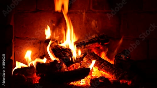 A fire burns in a fireplace