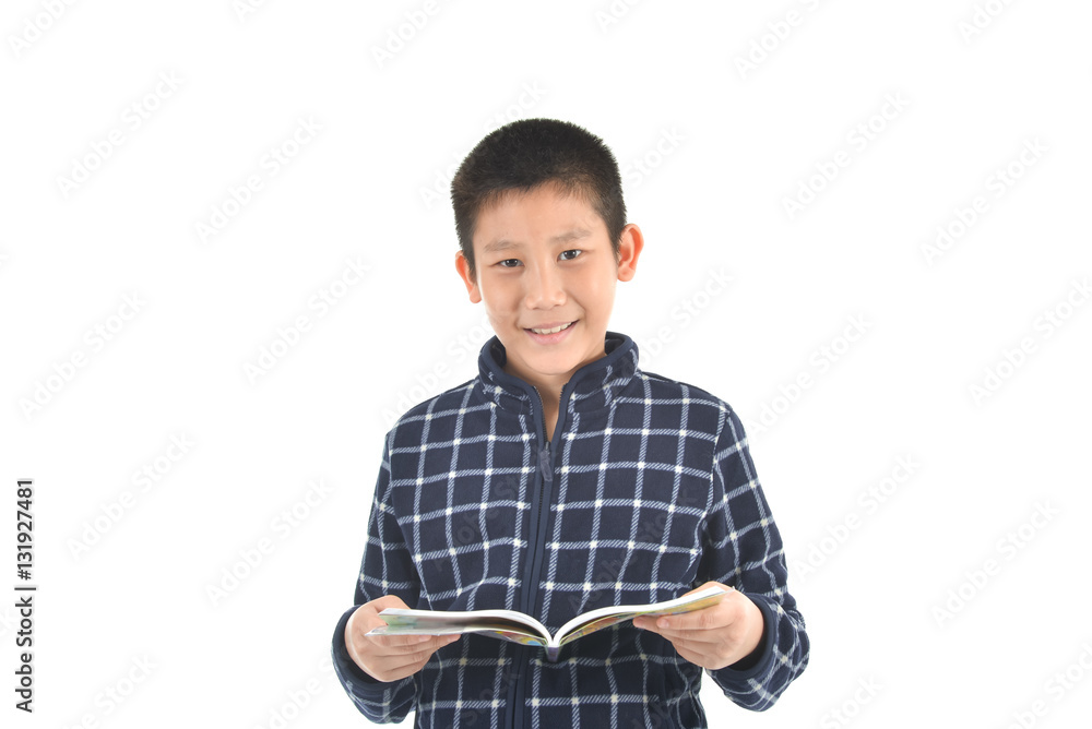 Asian boy reading at book on white background with copyspace. Asian boy reading at book on white background with copyspace.