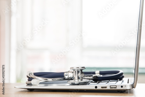 Stethoscope and laptop at the doctor's desk