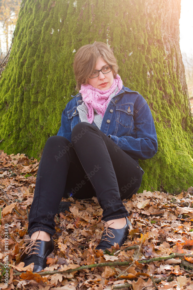 woman spending time in park during autumn season woman spending time in park during autumn season