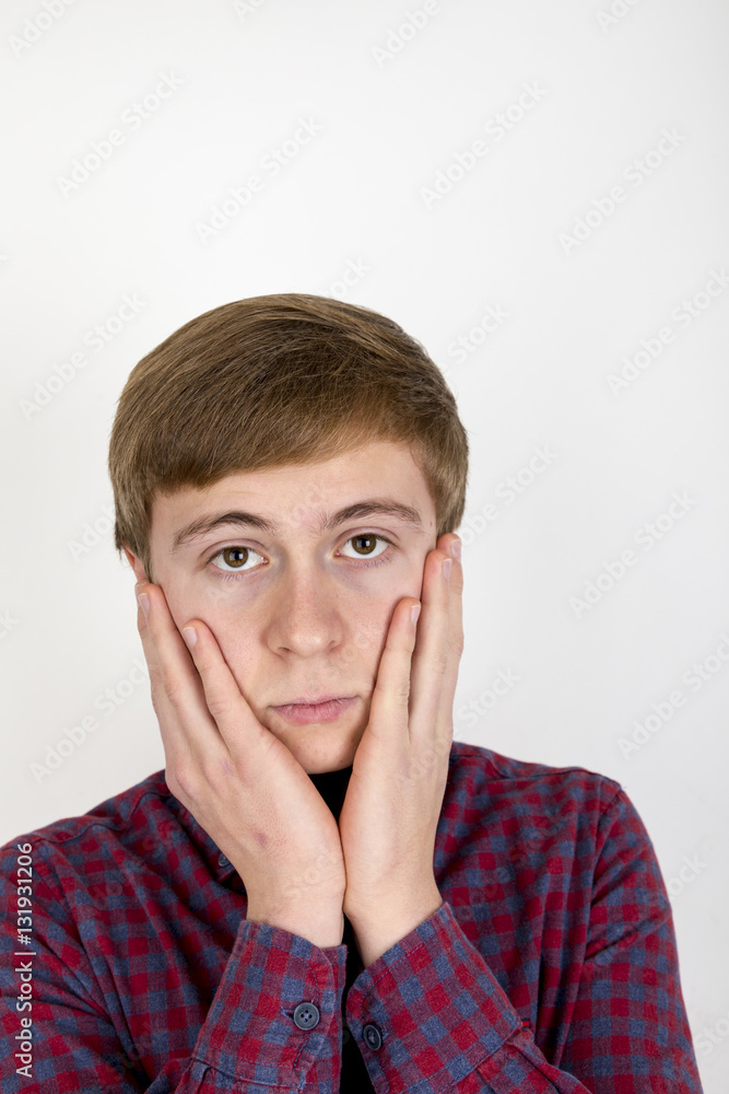 Portrait of sad handsome young man on white background Portrait of sad handsome young man on white background