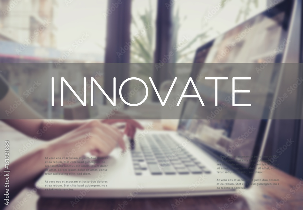 Naklejka premium business hand typing on a laptop keyboard with Innovate homepage on the computer screen innovation technology development aspiration concept.