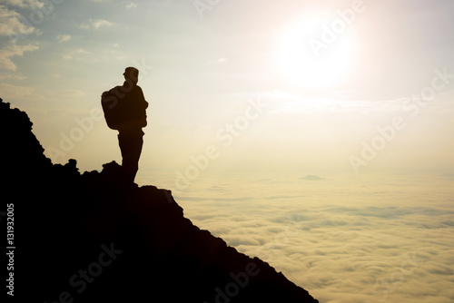 silhouette adventurer team on the mountain and sunrise. concept business success
