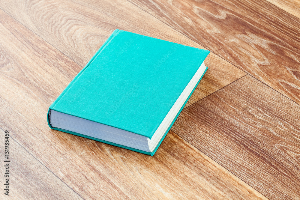Fototapeta premium The book turquoise colour in a firm cover.