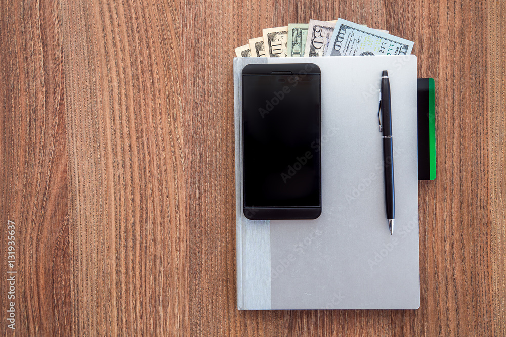 The daily log with denomination dollars on a wooden table.