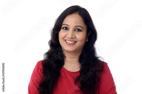 Portrait of cheerful woman against white background