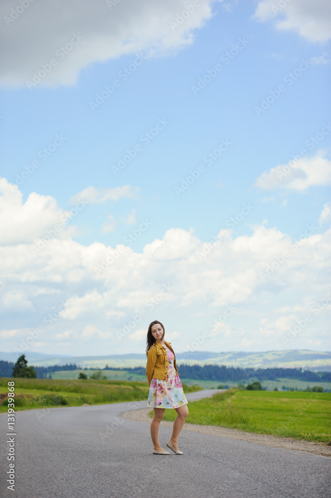 girl standing on asphalt