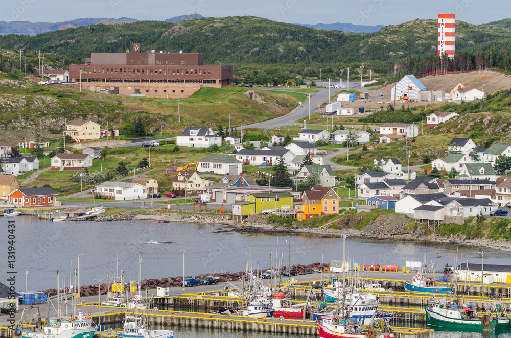 Small village community, Twillingate, Newfoundland.  Fishing boats docked along the shoreline in this coastal town, local roads connect the community along the Island's edges.