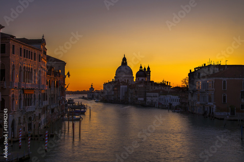 Dawn breaking over Santa Maria della Salute church in Venice, Italy as seen from the Ponte dell'Accademia