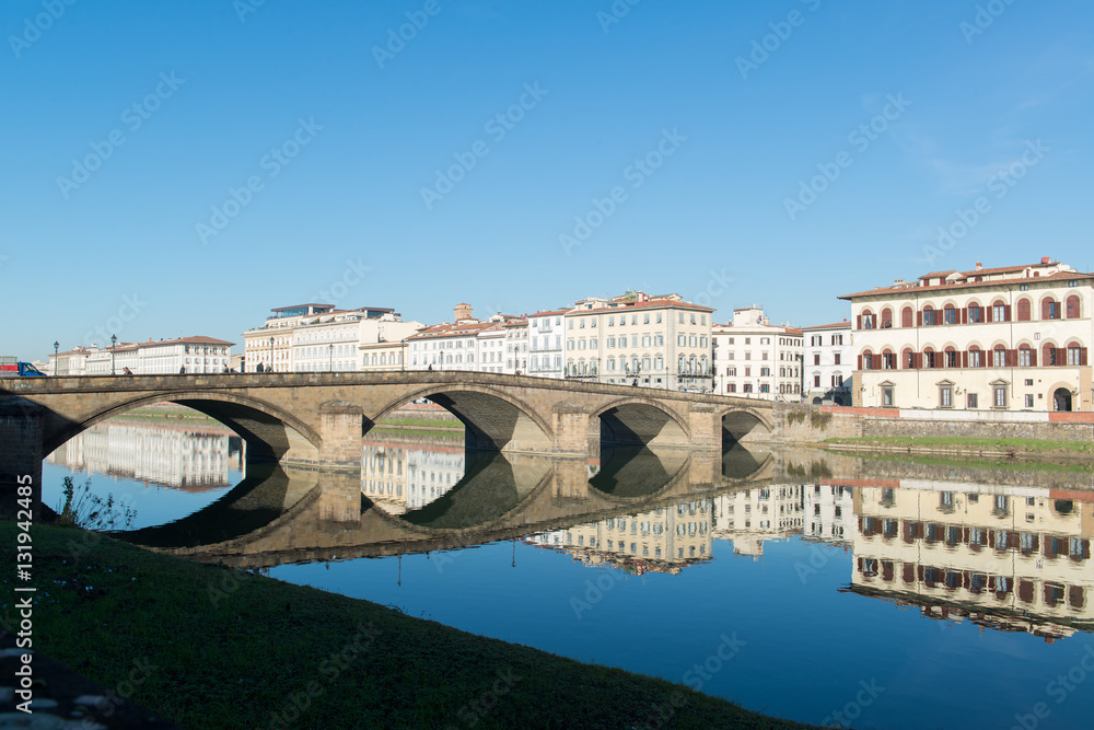 Fototapeta premium View of Arno river embankment with architecture and buildings a