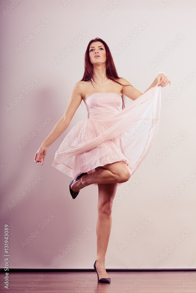 woman in bright dress and high heels shoes dancing woman in bright dress and high heels shoes dancing