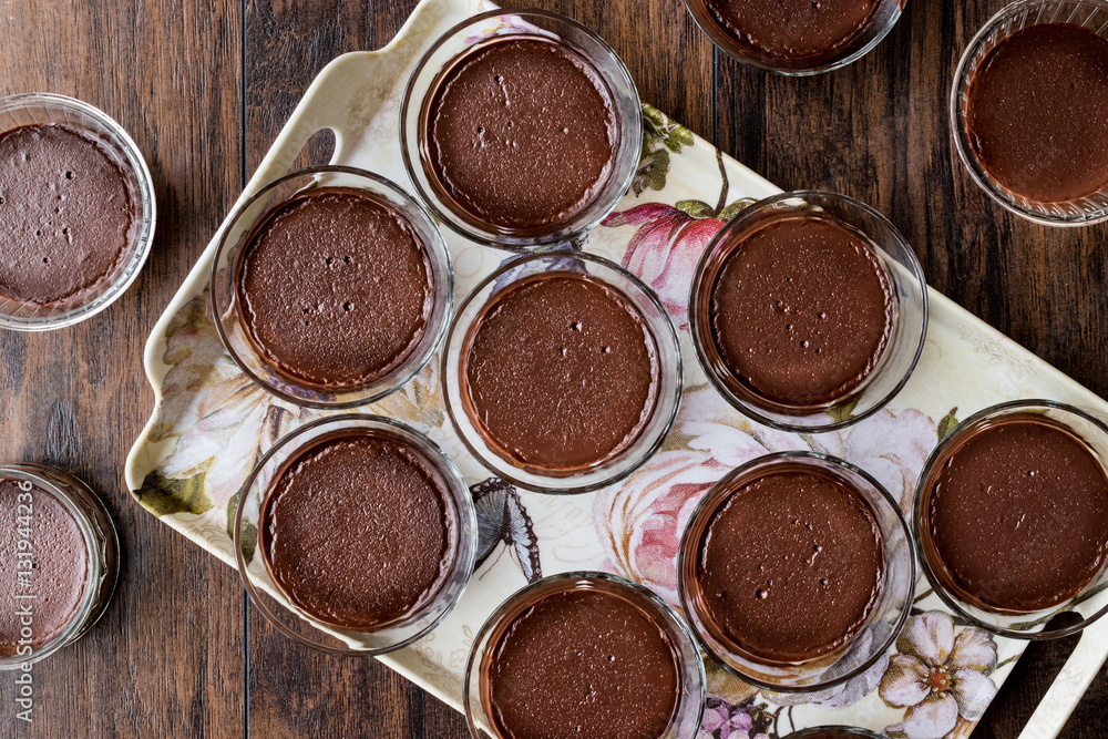 Homemade Chocolate Puddings in glass cups. Homemade Chocolate Puddings in glass cups.