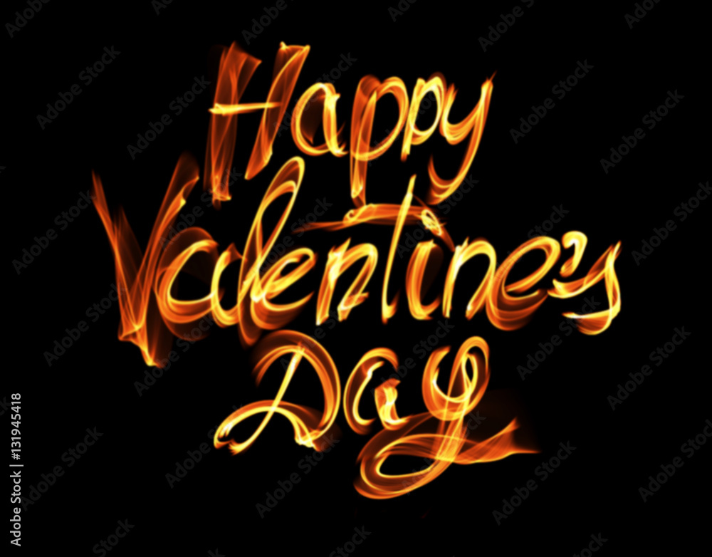 Happy Valentines day isolated words lettering written with fire flame or smoke on black background Happy Valentines day isolated words lettering written with fire flame or smoke on black background