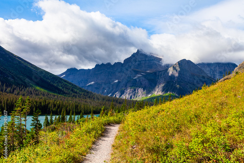 Grinnell Glacier Trail is a long, strenuous, and scenic path leading past three beautiful lakes to a spectacular glacier.