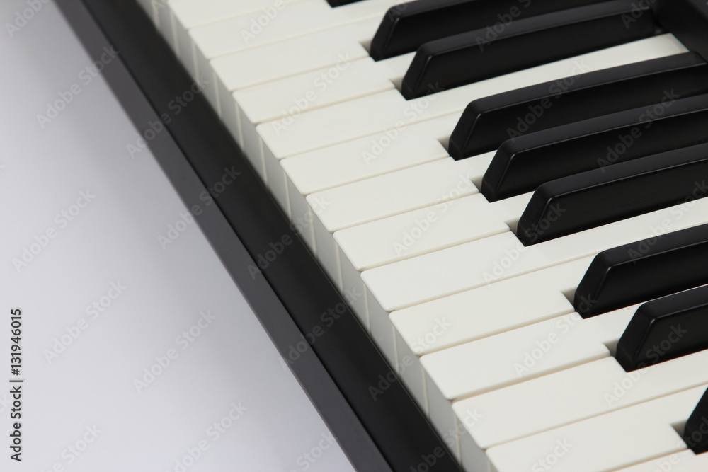 Naklejka premium the piano keys closeup on white background