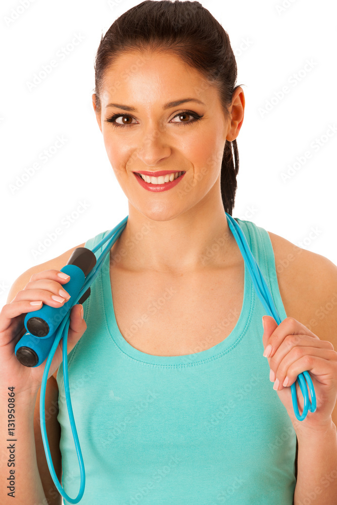 Beautiful young woman working out with speed rope isolated over Beautiful young woman working out with speed rope isolated over