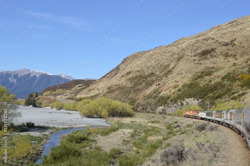 Train passing through valley in New Zealand Alps